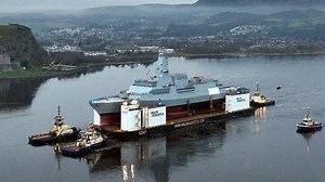 HMS Glasgow warship moved on barge down River Clyde