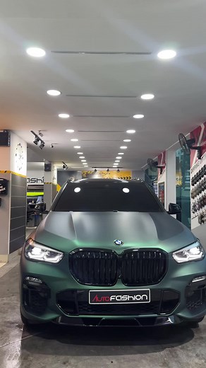 Custom Pine Green BMW X5 ///M with Turquoise Calipers and Custom Spoiler