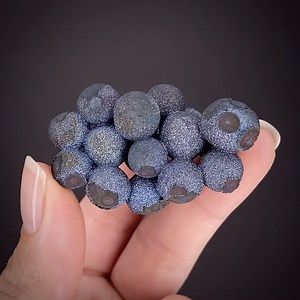 Chalcopyrite - near Tonglushan Copper Mine, near Daye, Hubei Province, China 💎 SHOP iRocks.com SM21-091 https://www.irocks.com/minerals/specimen/49365 This sparkly Chalcopyrite ball ("blister copper") specimen is a great example from this 2018 find in Daye County, China. This bright miniature is composed of over a dozen and a half bristling, metallic, iridescent blue balls averaging 1 cm in size. This combination of ornately connected Chalcopyrite orbs make up an aesthetic grouping of these uni