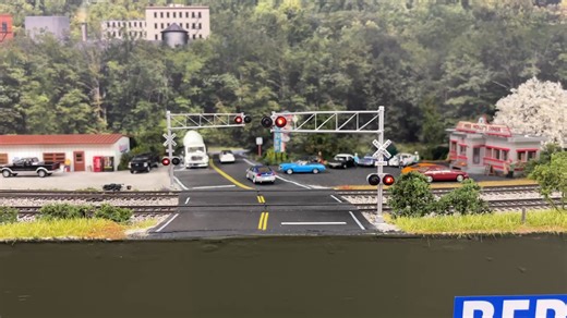 New cross bucks finally went in today on the upper level. 5 hours to get everything hooked up and installed, IR sensors and wiring took the longest. These are Walthers crossing signals being driven by an Azatrax MRX-3 Xing Controller. | NW Ohio Trains