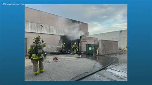 Norfolk firefighters put out a dumpster fire behind an auto shop early Sunday