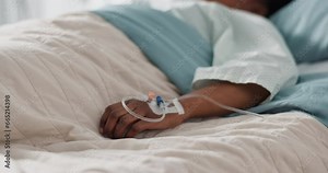 Healthcare, hand and iv with a patient in a hospital bed for recovery or rehabilitation closeup. Medical, wellness and treatment with a sick person lying in a clinic on a saline solution drip Stock Video