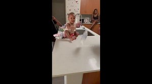 One-year-old girl lands bottle flip TWICE in a row