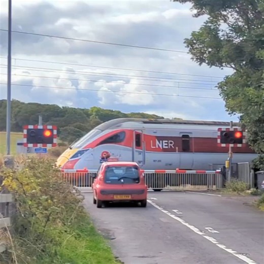 2026-09-16 LNER Azuma heading south at Scremerston level crossing.