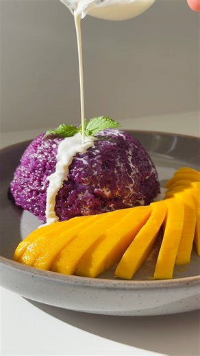 Mango Sticky Rice 🥭🍚 I’m Thai, and my mom taught me the authentic way to make mango sticky rice, but I’m too stubborn to follow all her steps (who has 8 hours to soak rice? 😂). So I created my own easy, lazy shortcut that keeps the real Thai taste and flavor, takes less than 45 minutes, and honestly turned out amazing! ⸻ Ingredients Sticky Rice 1 cups sticky rice 1 cups water Coconut Milk Mixture 1 cup full fat coconut milk 1/3 cup sugar 1 tsp salt 2 tbsp purple sweet potato powder (for natur