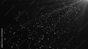 A shot of real snow/dust particles floating in the air. Background with dust particles. light in the upper right corner. 4К