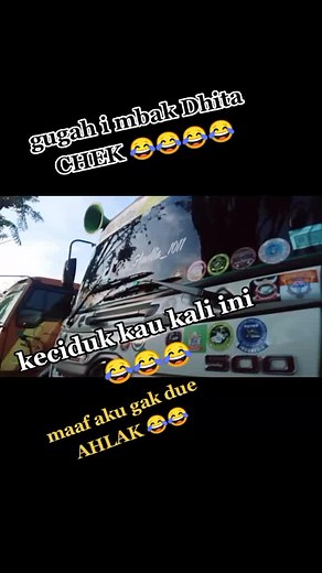 Teal Truck Decorated with Stickers and Humor