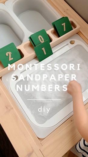 Wendy | Pediatrician on Instagram: "DIY MONTESSORI “SANDPAPER” NUMBERS ✨ Instead of sandpaper numbers, we used burlap number stickers to make our own. The raised number allows for a tactile tracing experience, and there are so many ways to play with the tiles! ⭐️ HOW TO ⭐️ Paint wood tiles (from Amazon under DIY). Let dry and add stickers - ours are made of burlap from @joann_stores, but there are lots of alternative textures sticker options too. You could also hot glue on beans or pipe cleaners