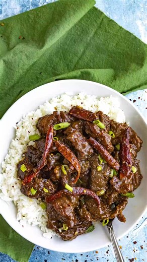 This Mongolian beef recipe is so easy to make with beef stir fried until crispy, then tossed in a sticky, spicy brown sauce, served with rice or noodles. Ingredients: FOR THE BEEF 1 pound flank steak 1 tablespoon vegetable oil 1 tablespoon soy sauce 1 teaspoon baking soda 2 tablespoons cornstarch FOR THE MONGOLIAN BEEF SAUCE 1/4 cup soy sauce 1/4 cup beef stock or use chicken stock 2 tablespoons brown sugar or more to taste FOR THE MONGOLIAN BEEF STIR FRY 1/2 cup vegetable oil for frying 1/2 cup