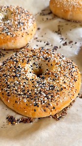 20K views · 171 reactions | Homemade New York–style bagels, fresh out of the oven 說 Everything seasoning, sesame, and melty cheddar on top… chewy inside, golden outside #bagels #nycbagels #homemade #bagelrecipe | TheCanok | Facebook