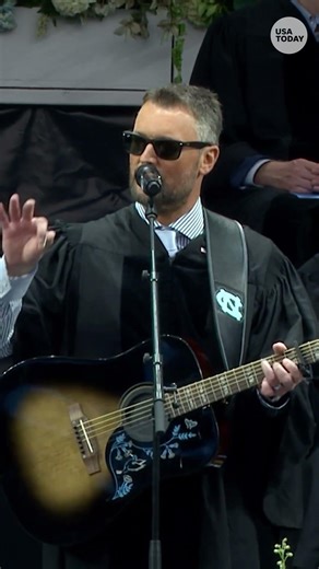 Eric Church uses guitar to explain life at UNC graduation. See the musical moment.