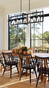 Imagine watching the autumn leaves change in this dining room. 🍂🍁 Featured: 400 Series picture windows with a two-over-two colonial grille pattern #AndersenWindows #ContemporaryDesign #ModernDesign #DiningRoomsOfInstagram | Andersen Windows Doors