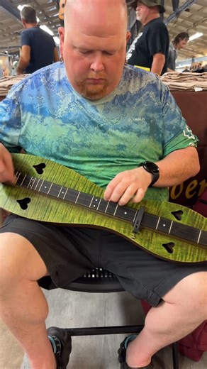 The Dulcimer Shoppe on Instagram: "Aaron ordered this lovely green dulcimer a little while ago and he picked it up this morning. It’s a walnut dyed maple with an ebony fretboard and black pegs. He loves it and as you can tell he’s been playing for a long, long time. It was great seeing you again Aaron! Enjoy your new dulcimer! Come see what you’ve been missing! #mcspaddendulcimer #walnut #maple #dyedwood #seaweed #madeinarkansas #madeinamerica🇺🇸 #shopsmall #baystlouis #walnutvalleyfestival #bl
