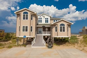 It is the oceanfront beach house dreams are made from! Timeless charm, classic elegance...this is Quiet Time! Floor to ceiling windows allow for a view of the ocean second to none. https://bit.ly/2GjoDS9 | Sandbridge Realty