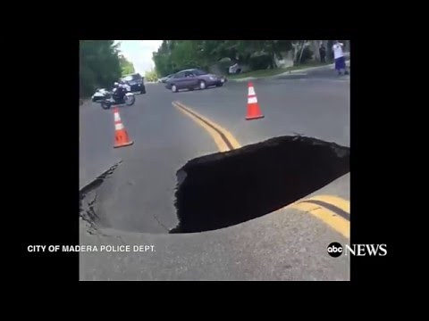 Giant Sinkhole Opens Up In Cali Neighborhood [CAUGHT ON TAPE]