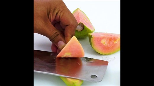 Cutting A Guava Fruit