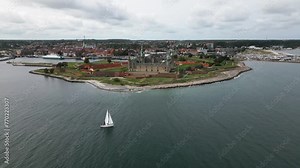 huge castle directly on the coast, kronborg slot, sailboat crosses the sea, little town, baltic sea, helsingor, denmark, europe, drone