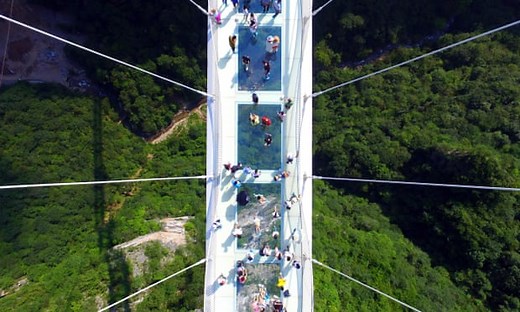 World’s longest glass-bottomed bridge opens in China – video
