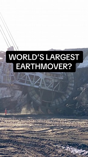 A video of Bagger 285, one of Bagger 288’s siblings, in action. These German bucket wheel excavators are some of the largest machines on Earth. They can move 240,000 cubic meters (315,000 cubic yards) of dirt daily. From here, everything travels by conveyor, eliminating trucks. The machine weighs over 13,000 tons! Check out the person on the ground guiding the machine for a sense of scale.