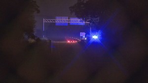 Driver hospitalized after driving through gap between overpasses, going down hill