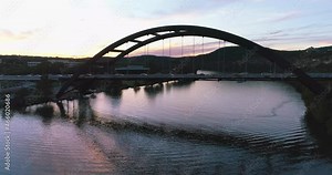 Pennybacker Bridge Flyover 360 Bridge in Austin Texas on Colorado River at Sunset (Aerial Drone View in 4k) Stock Video
