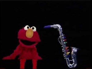 Sesame Street Elmo Plays A Saxophone Music Lesson