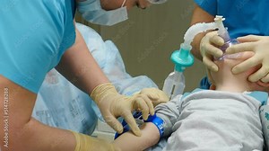 General anesthesia in hospital. Surgical intervention. Anesthesiologist at work. Breathing tube and mask on kid face. Artificial ventilation of lungs. Healthcare and life saving concept. Preparation