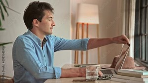 Man Opens Laptop Computer and Types on Keyboard in Home Office Close Up. Entrepreneur Works Online with Internet Connection on Mobile Device. Executive Learns Business Success and Writes Web Document
