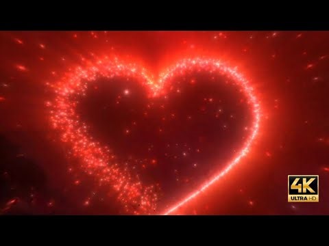 4k Valentine's day background loop glowing red love heart made of particles