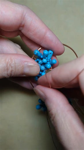 Making a tree-of-life pendant with turquoise-colored howlite beads. | Camille Sharon