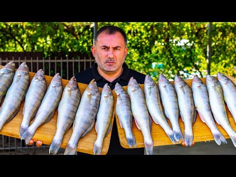 FISH with VEGGIES in a CAULDRON in the OPEN FIRE.