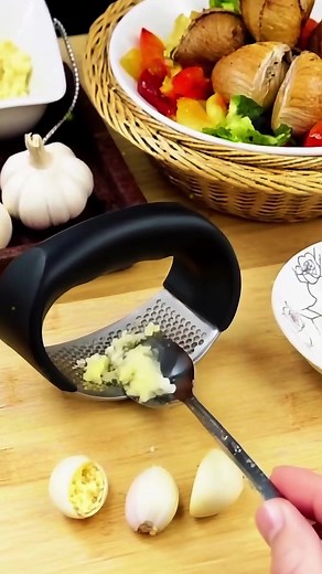 "Press garlic like a pro! 🧄✨ #StainlessSteelGarlicPress #KitchenGadge...
