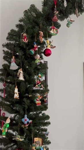 Christmas arch instead of a tree loaded with Disney ornaments and family heirlooms #studiolife