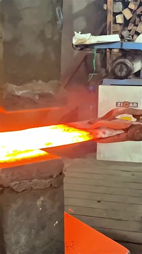 Series of hammer blows on hot metal, sparks flying as the excess slag is scraped off. Watch as the knife is edge ground, heated in the forge, and then quenched in liquid, producing heavy steam. Finally, the finished knife is displayed on a wooden cutting board. ​ ​ #ForgedKnife​ #Metalworking​ #craftsmanship ​#fyp #viral