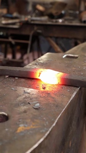 Slitting and drifting holes in iron bar