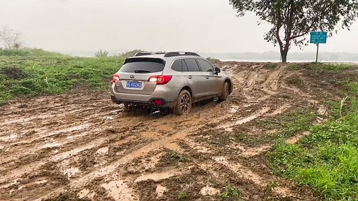 Subaru SUV Conquering Muddy Off-Road Trails
