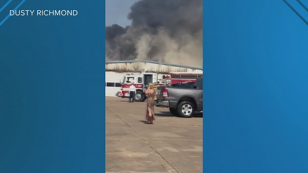 Crews battle massive fire at Chevy car dealership in West
