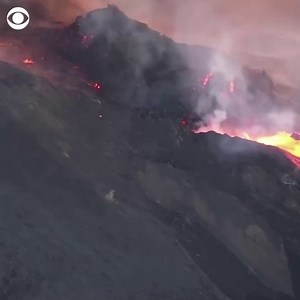 The main cone of the Cumbre Vieja volcano on the Spanish island of La Palma partially collapsed on Monday, creating a new river of lava. Now, lava has covered more than 3.5 square miles of La Palma and destroyed at least 2,162 buildings. | CBS News