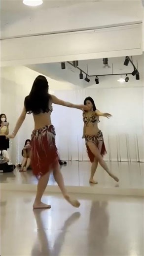 Mesmerizing Belly Dance Performance in the Studio Mirror