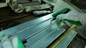 Manual worker assembling PVC doors and windows. Factory for PVC windows and doors production. Workers in workshop. Production of plastic windows