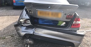 Car pushed over roundabout in van crash