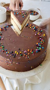 This Yellow Cake is a classic and its cake layers have a buttery texture and rich flavor. Then the layers are filled and frosted with a decadent Chocolate Fudge Frosting. This scratch-made cake is a perfect base for a variety of flavors and frosting. Perfect for birthday cakes or special occasions, go wild with creativity! 🍫 Check out this amazing recipe here: https://www.piesandtacos.com/yellow-cake-recipe/ | Pies and Tacos