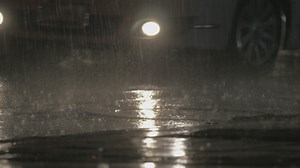 Rain falling over traffic - Free Stock Video