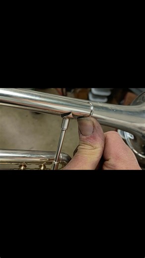 I received a call from a local college student about his Bach Strad Trumpet he had recently purchased from another local music store. His college trumpet teacher noticed something a bit off, and asked to take a look at the trumpet . He found this loose brace that he originally thought was never soldered at the Bach Factory. When I started working on this, I realized another technician had replaced the Leadpipe, not only forgetting to solder this brace, but also the main tuning slide is not in pa