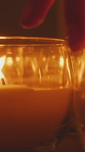 Candles in the dark arranged by a person's hand - Free Stock Video
