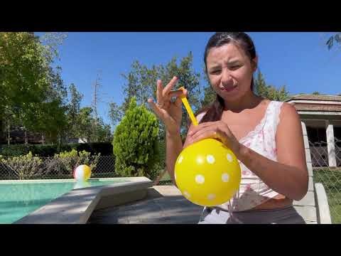 Cute Looner Girl Blows up Yellow Balloon Outside