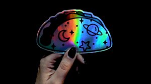 "Taco" bout a sticker that is out of this world.  Our holographic stickers dance in the light, making a statement wherever they go.  Shop here now: https://bit.ly/3OJaBgo | The Sticky Brand | Facebook