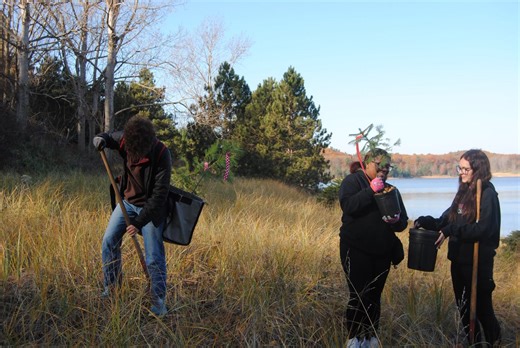 High School Interact Volunteers from Reeths Puffer, Orchard View and North Muskegon alongside several community volunteers work together with the Muskegon Conservation District to plant trees and dune grass at Dune Harbor Park Muskegon County. This project is funded by the Planet Award Grant from the Consumers Foundation. | Muskegon County Parks