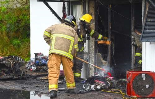 ‘Hose’ counts the cost as fire sweeps through Paget clothes shop