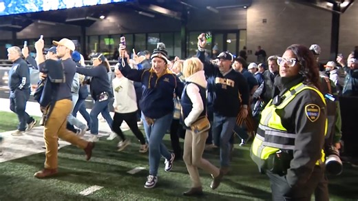 Bobcats fans and players celebrate on the field after winning the FCS Championship game in Nashville, Tennessee. | NBC Montana